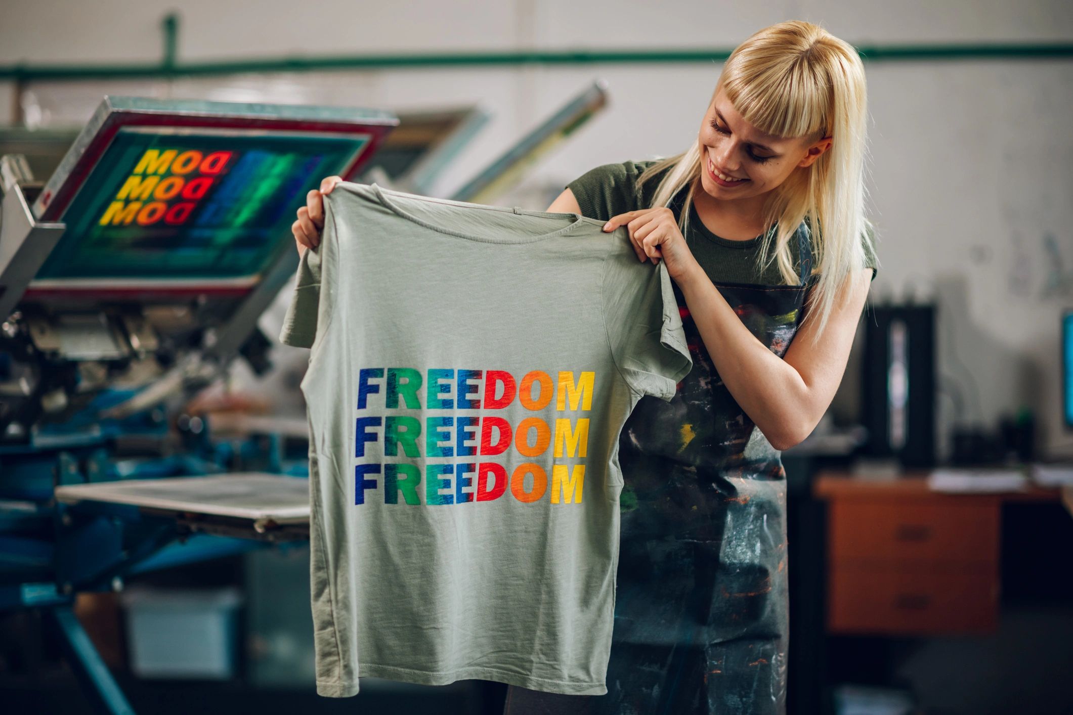 Woman holding custom printed t-shirt